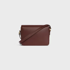 Bolsa TRIOMPHE TEEN em couro de bezerro brilhante