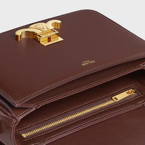Bolsa TRIOMPHE TEEN em couro de bezerro brilhante